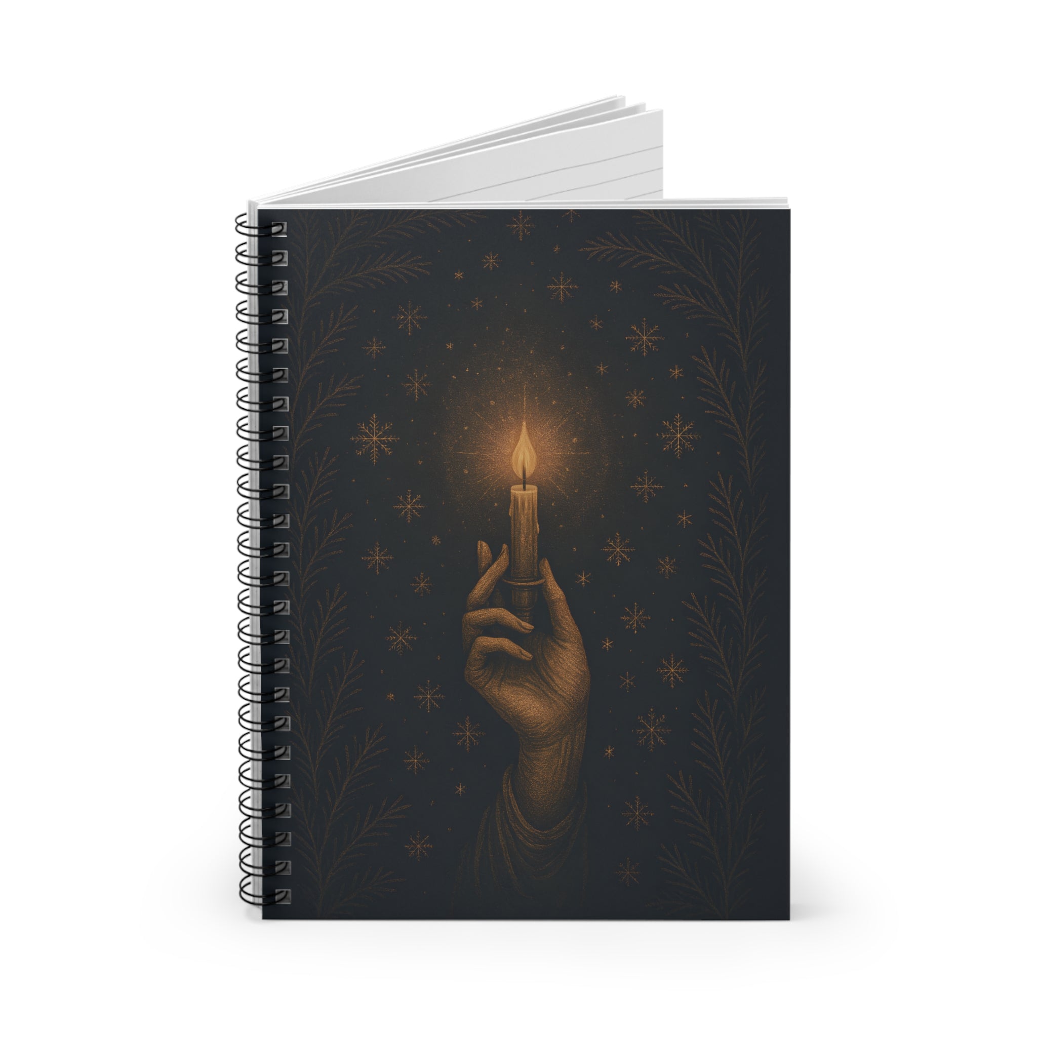 Notebook with a design of a hand holding a candle against a dark background with stars.