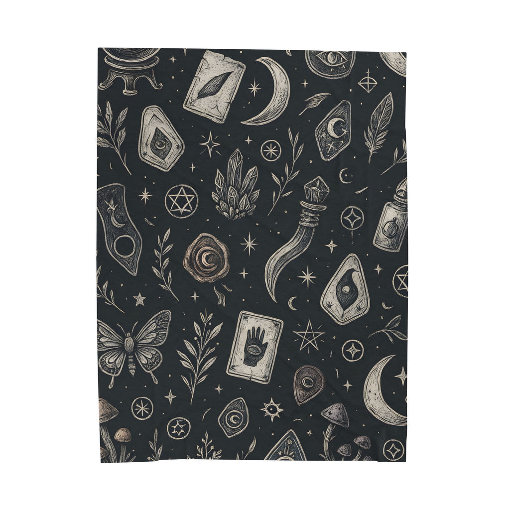 Patterned blanket with mystical symbols on a dark background