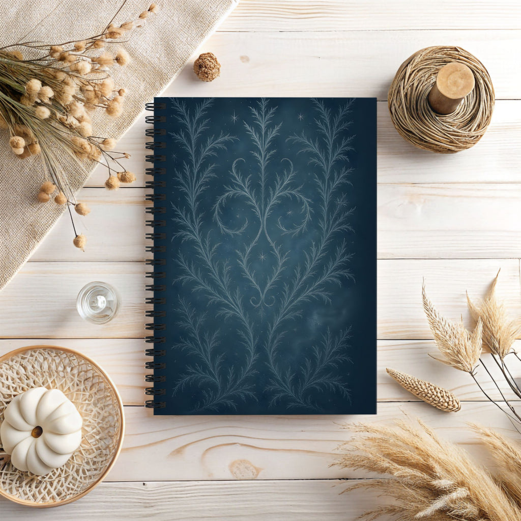 Notebook with decorative cover on a wooden surface with autumn elements