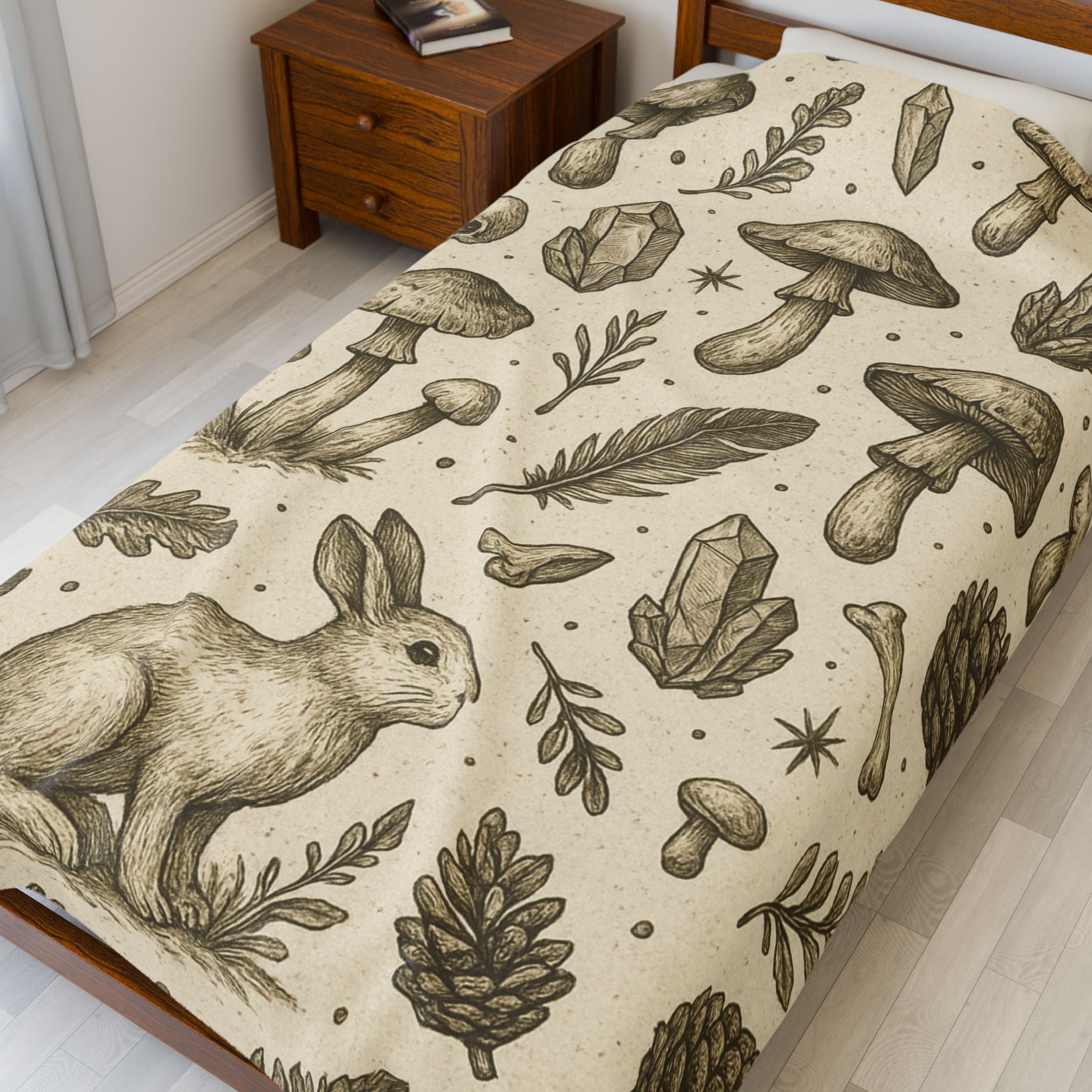 Bedspread with nature-themed design featuring a rabbit, mushrooms, and crystals on a beige background.