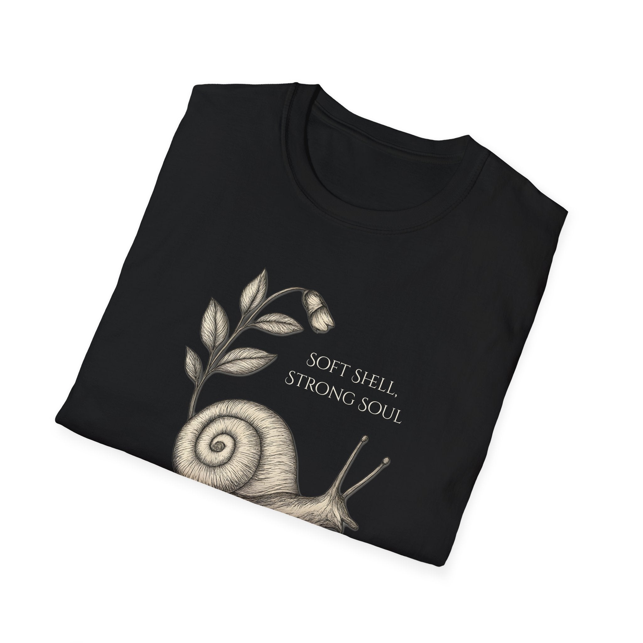 Folded black t-shirt with a snail illustration and text on a white background