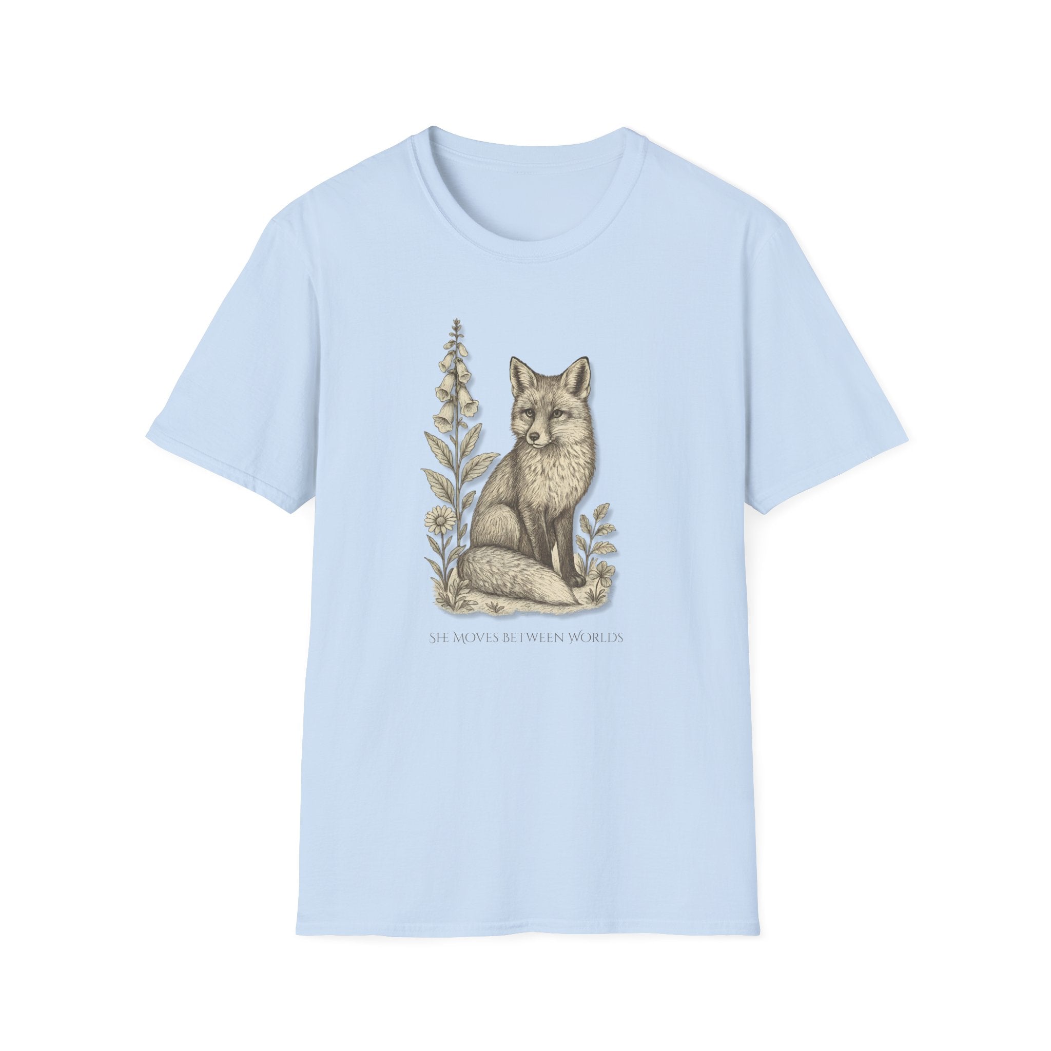 Light blue t-shirt with a fox and floral design on a white background. "She Moves Between Worlds" Fox T-Shirt