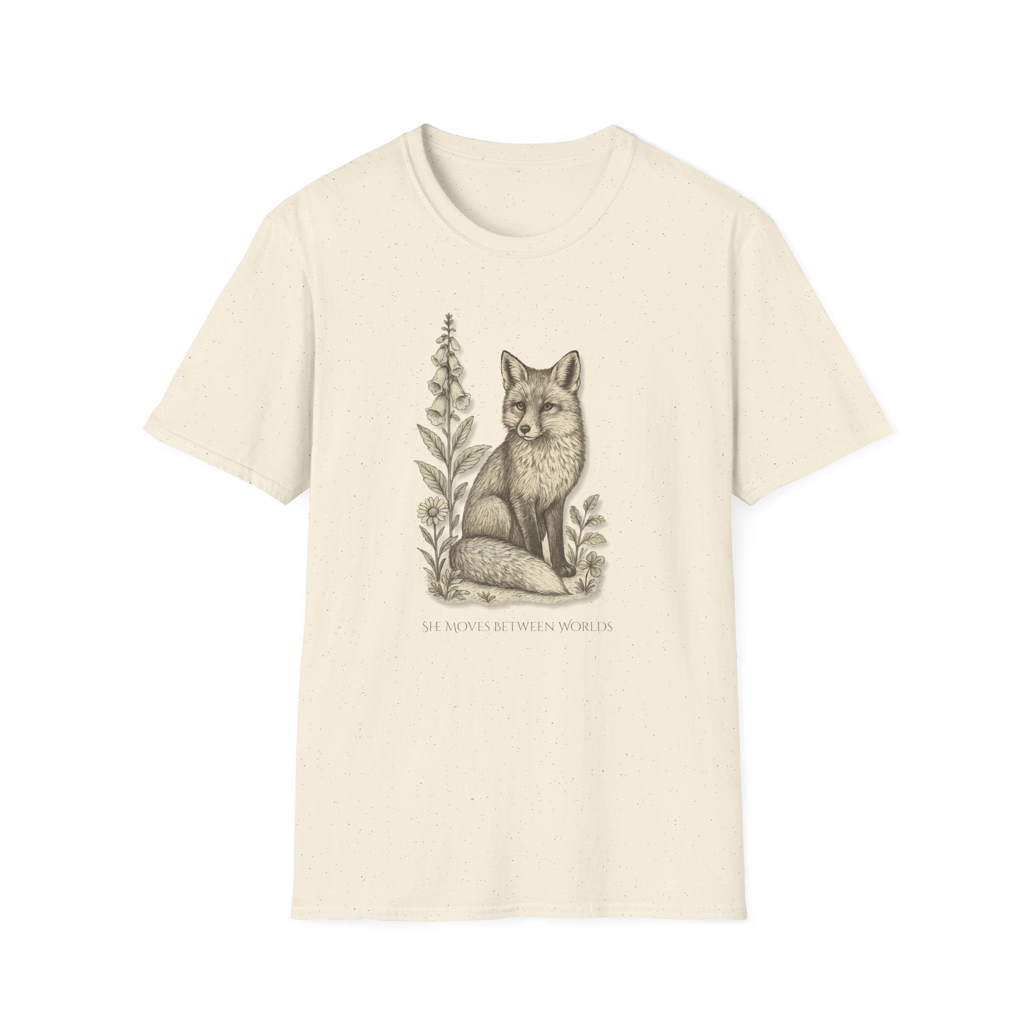Beige t-shirt with a fox and plant design on a white background. "She Moves Between Worlds" Fox T-Shirt